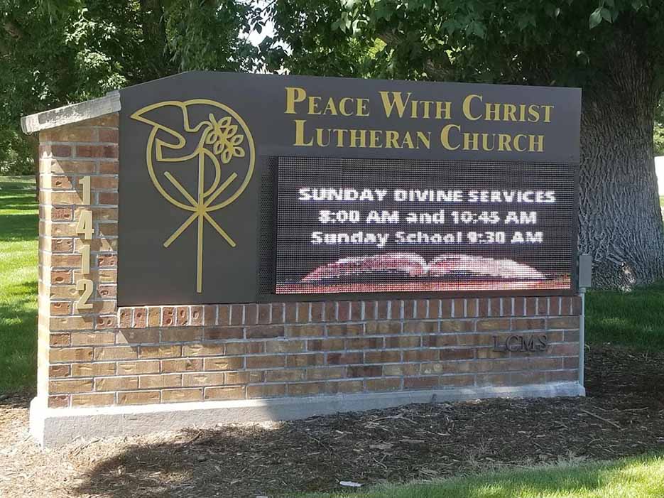 Peace With Christ Lutheran Church sign, Fort Collins CO, worship Sundays 8AM & 10:45AM