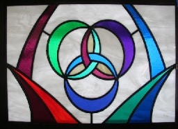 Stained glass window showing interlocking Trinity symbol